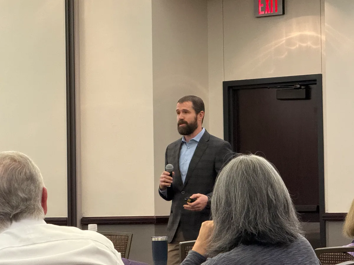 Tyler Fisher speaking at a leadership event