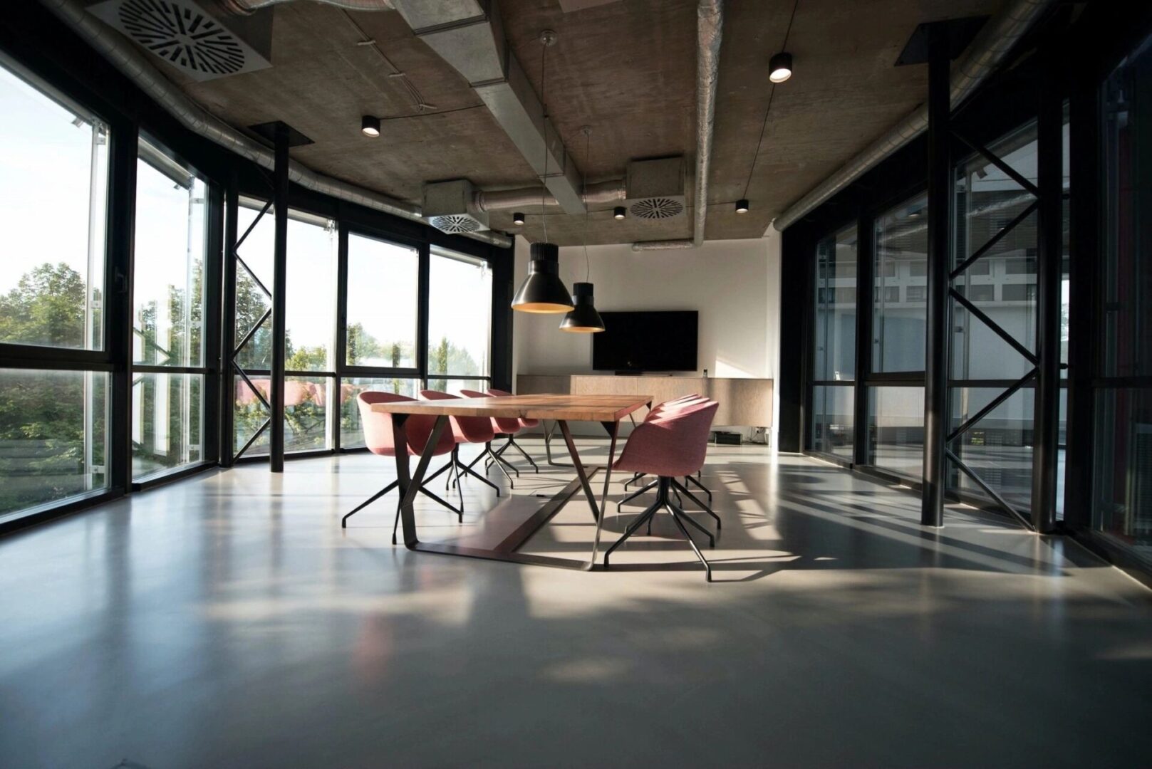 A room with a table and chairs in it